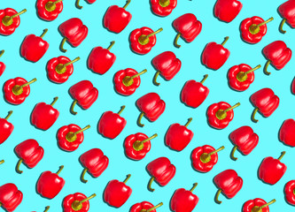 Graphic Background Pattern Of Red Peppers Against Blue Background