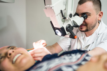 Muslim woman under medical checkup of ear