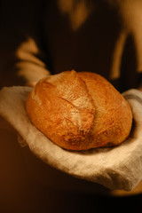 Assortment of baked bread on wooden table background. Bread background, top view of white, black and rye loaves. Healthy and nutritious food. The product contains carbohydrates.