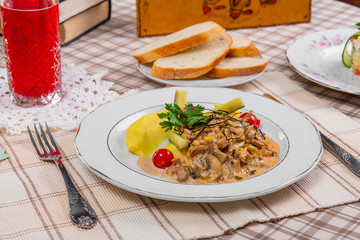beef stroganoff with mushrooms and mashed potatoes