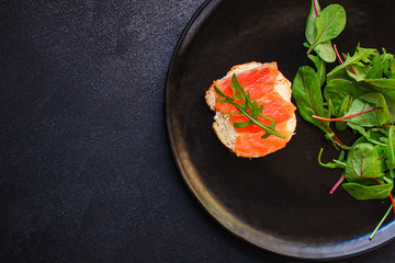 sandwich salmon smorrebrod (delicious snack seafood fish) menu concept. food background. top view. copy space