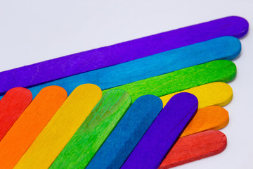 arrangement of multicolored wooden sticks - closeup