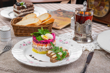 puff salad with fish sandwich in a brown cage