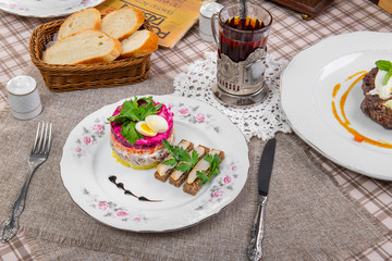 puff salad with fish sandwich in a brown cage