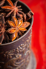 Dried anise stars on the rustic background. Selective focus. Shallow depth of field.