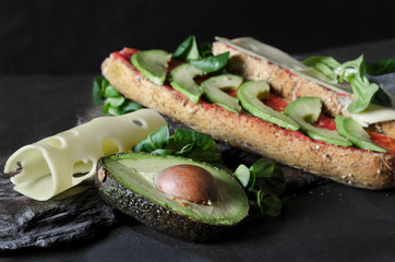 An appetizing breakfast. Wholemeal bread, avocado, tomato and cheese. Delicious!