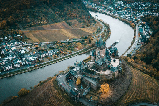 Drone shot of the Castle Of Cochem (Reichsburg) by the meander of the Mosel River in the wine valley in Germany