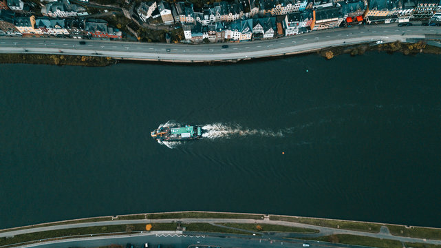 Aerial shot of an inland shipping boat on the Mosel River in Cochem, Germany, Europe
