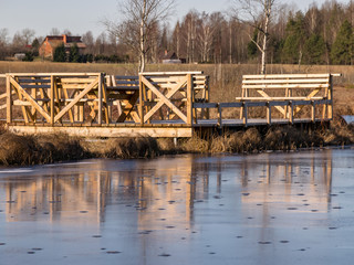 Fototapeta na wymiar winter landscape with wooden pedestrian platform