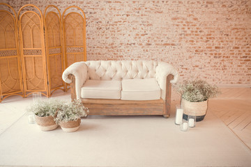 Home interior with easter decor. Mockup with a white frame and willow branches in a vase on a light background