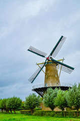 Goes, the netherlands, august 2019. In the countryside of the zealand region, a perfectly preserved and functioning windmill. Typical postcard landscape of the Dutch countryside.