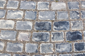 The structure of natural stones in close-up. Stones are a natural road surface that is durable and hard.