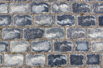 The structure of natural stones in close-up. Stones are a natural road surface that is durable and hard.