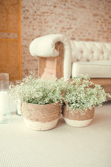 Home interior with easter decor. Mockup with a white frame and willow branches in a vase on a light background