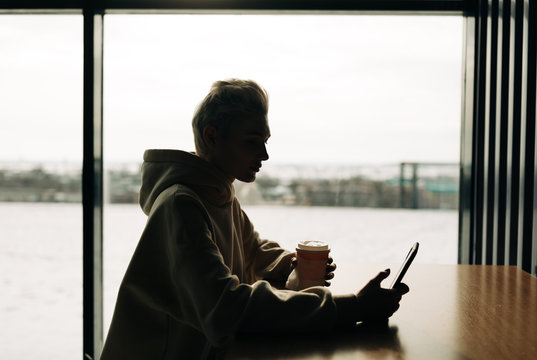 Young woman on the phone in cafe - Powered by Adobe
