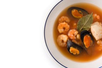 French bouillabaisse soup in white plate isolated on white background.Top view. Copy space