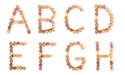 Set of letters from wine corks, alphabet isolated on a white background.