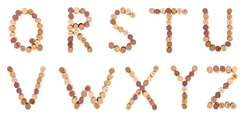 Set of letters from wine corks, alphabet isolated on a white background.