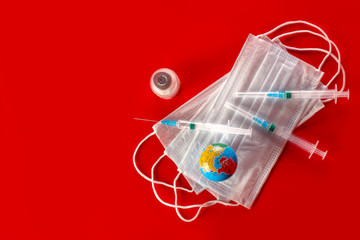Surgical or viral mask, syringe and blood sample, vaccine ampoule. Virus epidemic concept, medical...