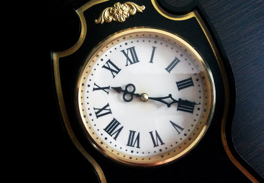 Vintage black watch with Roman numerals so close