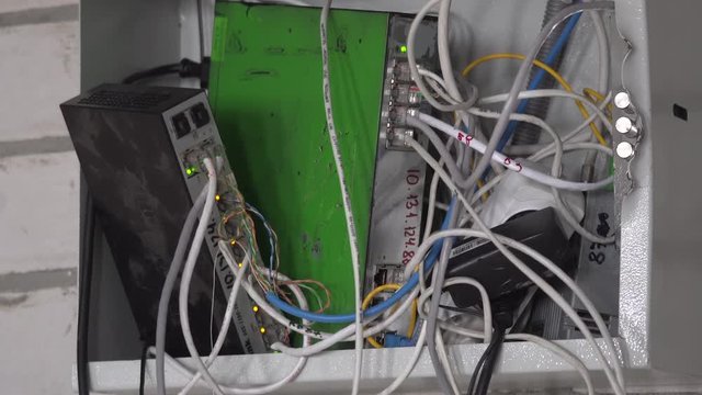 Computer network. Data cables are connected to the router. Close-up. High speed internet. Switch cabinet. Tangled Cords