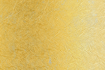 Gold background. Rough golden texture. Luxurious gold paper template for your design.golden glossy handmade paper texture