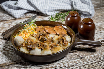 Stewed pork chop in a bright mushroom sauce.
