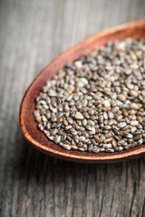 Chia seeds on the wooden table. Selective focus. shallow depth of field.