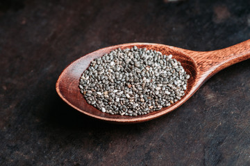Chia seeds on the wooden table. Selective focus. shallow depth of field.