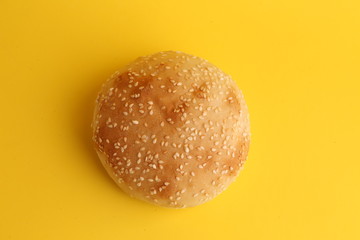 delicious bread rolls on colored background