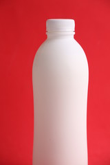 liquid yogurt bottle in color background