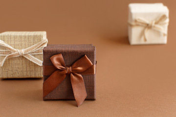 Brown tones gift boxes on a brown background