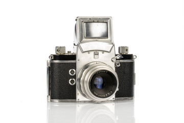 One whole silver vintage camera isolated on white background