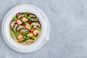 Salmon Noodle Soup with shiitake mushrooms, edamame beans and green onion.
