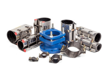 Several types of clamps to tighten on an white background.