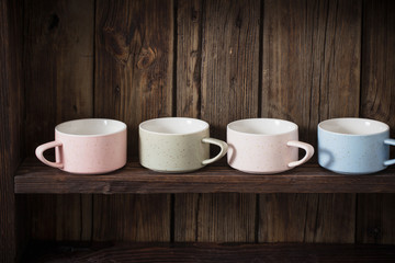  kitchen dishware on old dark wooden background
