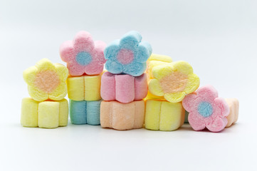 Pastel sweet flowers shape of marshmallows on white background.