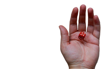 Close-up of a male hand holding dice which is red colored on isolated white background.	