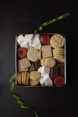 Assorted cookies in a metal cookie box 
