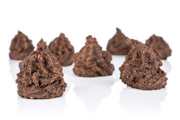 Group of seven whole homemade brown coconut cocoa biscuit isolated on white background