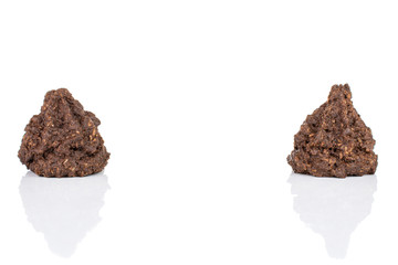 Group of two whole homemade brown coconut cocoa biscuit isolated on white background