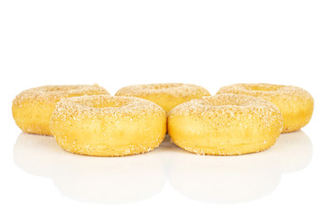 Group of five whole sweet golden mini cinnamon donut isolated on white background