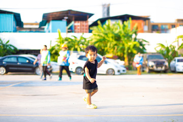 Little toddler asian baby boy walking along playgound outdoor the street new activity experience
