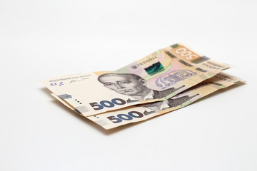 Two new banknotes in denominations of 500 Ukrainian hryvnias isolated on a white background with shadow. European money exchange. Ukraine currency