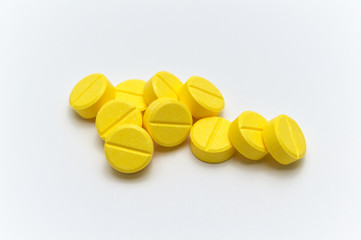 Prescription drugs,medicine of tablets or pills with yellow color. On white background.