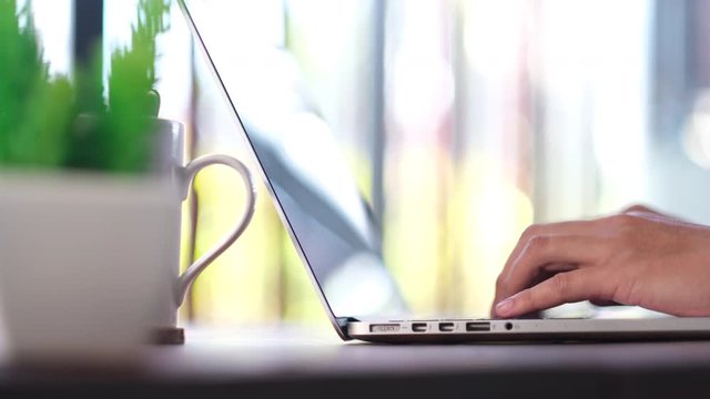 businessman working from home typing on laptop safety from corona virus, covid 19 business concept