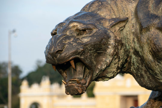 A statue of a ferocious tiger made of bronze