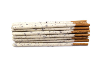 Chocolate biscuit stick coated with milk flavour confectionery and crushed cookies and cream taste isolated on white background.