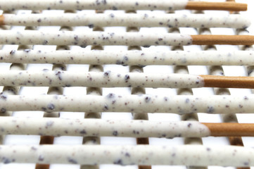 Chocolate biscuit stick coated with milk flavour confectionery and crushed cookies and cream taste isolated on white background.