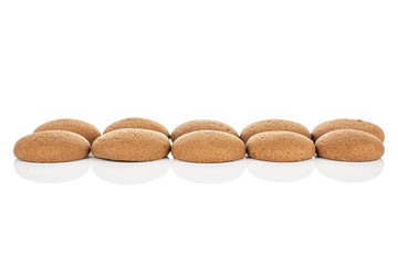 Group of ten whole sweet brown chocolate sponge biscuit isolated on white background